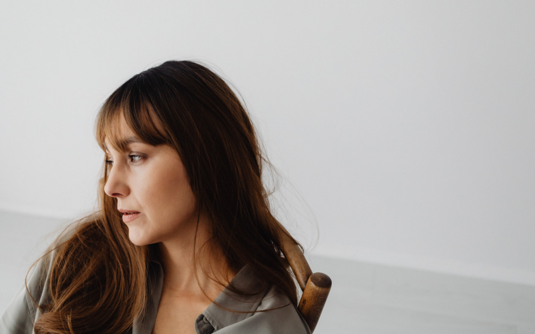 woman who is burnt out looking out the window